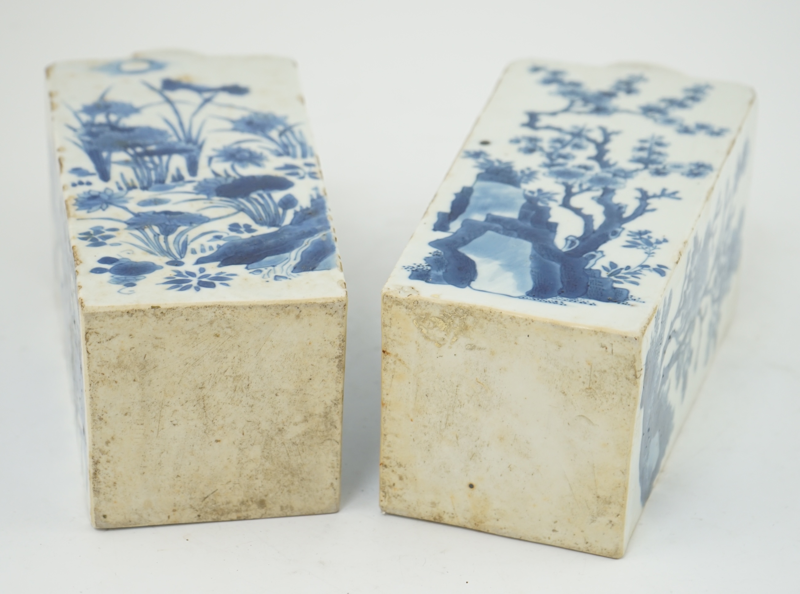 A pair of Chinese blue and white square section vases, Kangxi period